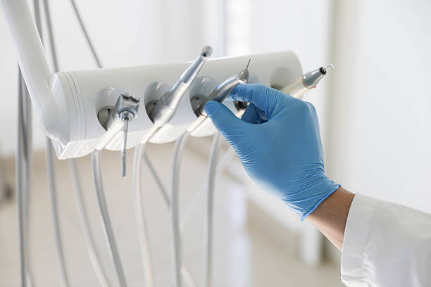 Professional Tooth Extraction technician working in Rossville, MD